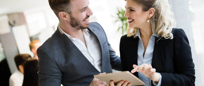 Cheerful coworkers in office during company meeting